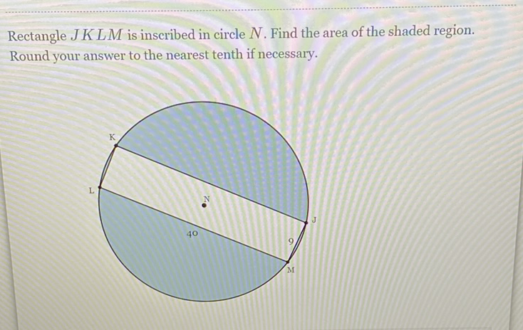 Rectangle \( J K L M \) is inscribed in circle \( N \). Find the area of the shaded region. Round your answer to the nearest tenth if necessary.